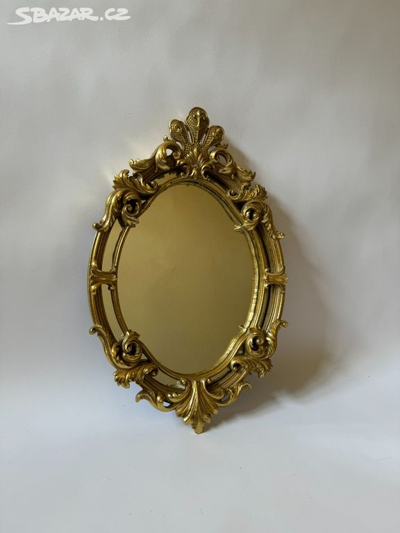 Zrcadlo - ovál ve zlatém zdobeném rámu