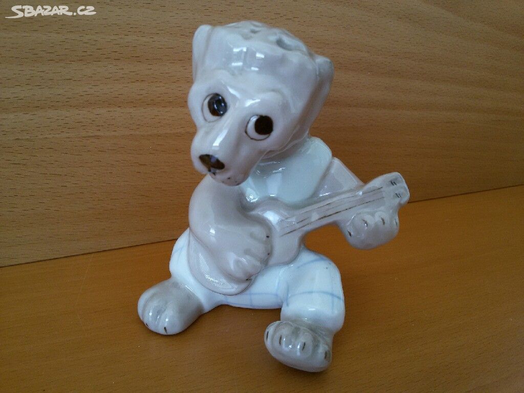 STARÁ PORCELÁNOVA SOŠKA. LEV S KYTAROU.