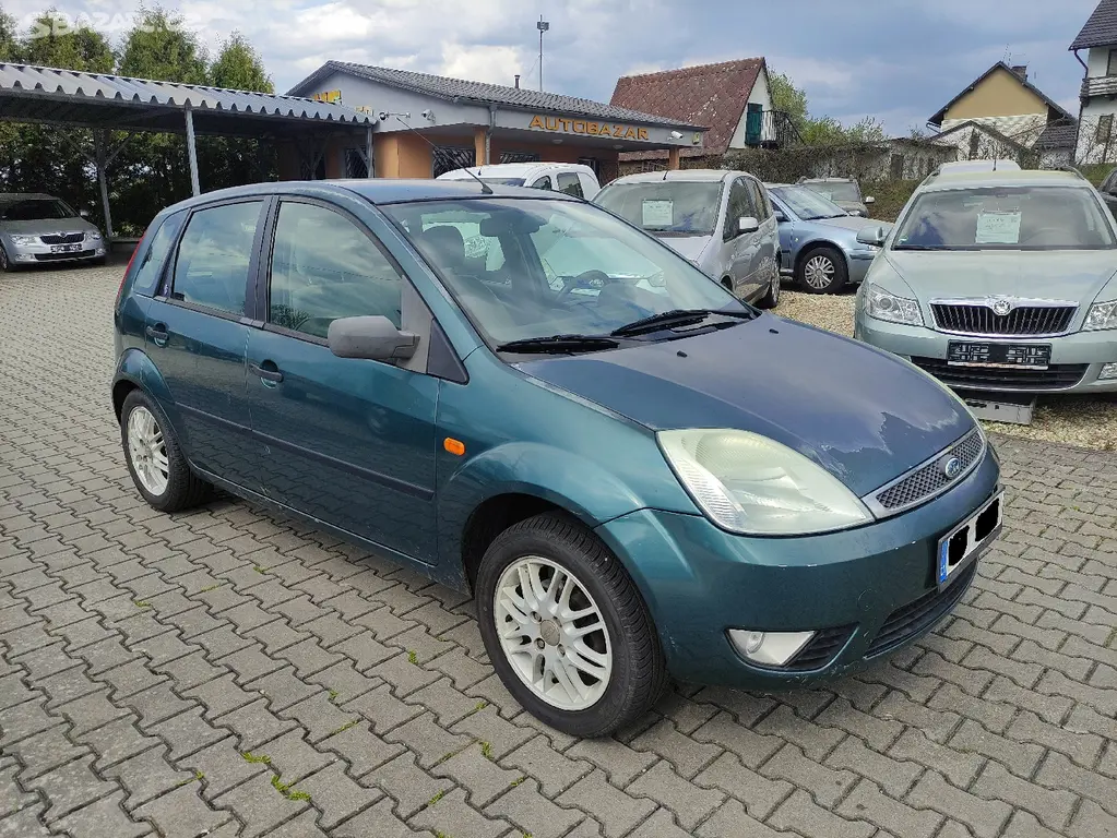 FORD FIESTA 1.6I 16V 74KW,GHIA,ALU,KLIMA,CD - fotka 3
