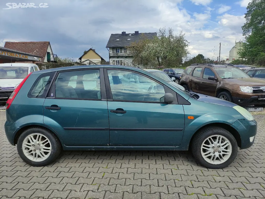 FORD FIESTA 1.6I 16V 74KW,GHIA,ALU,KLIMA,CD - fotka 4